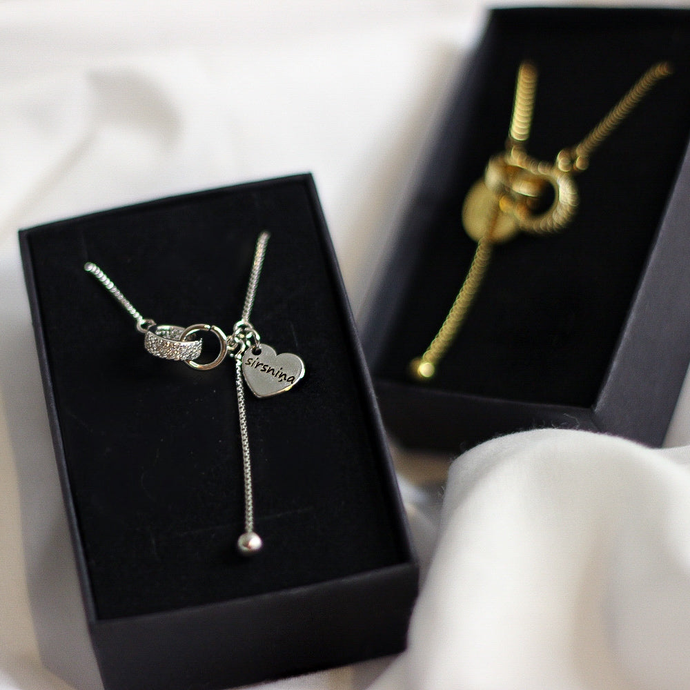 Kaklarotas sievietēm AMOR zelta un sudraba krāsā ar dāvanu iepakojumu.