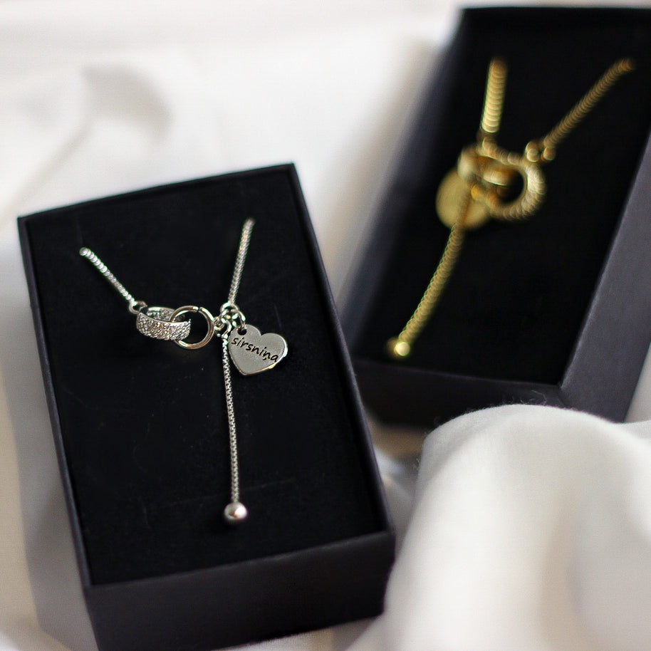 Kaklarotas sievietēm AMOR zelta un sudraba krāsā ar dāvanu iepakojumu.